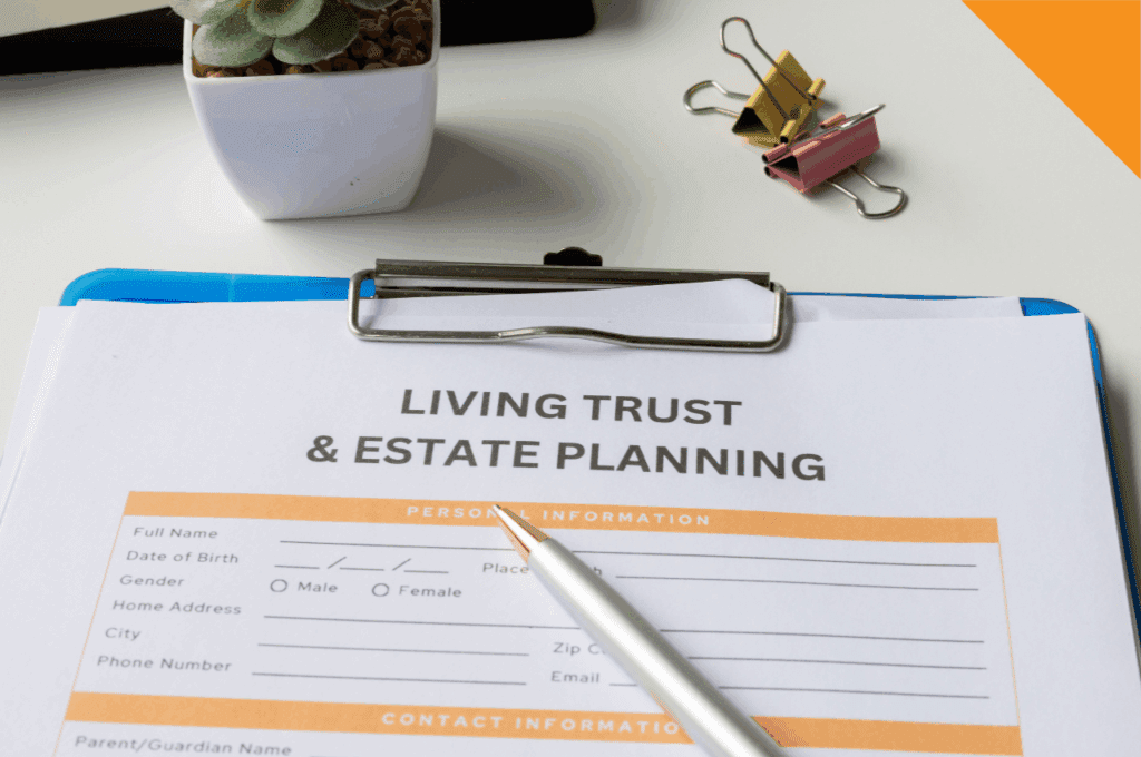 Living trust and estate planning form on a clipboard with pen on desk.
