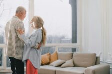 Older couple dancing in living room
